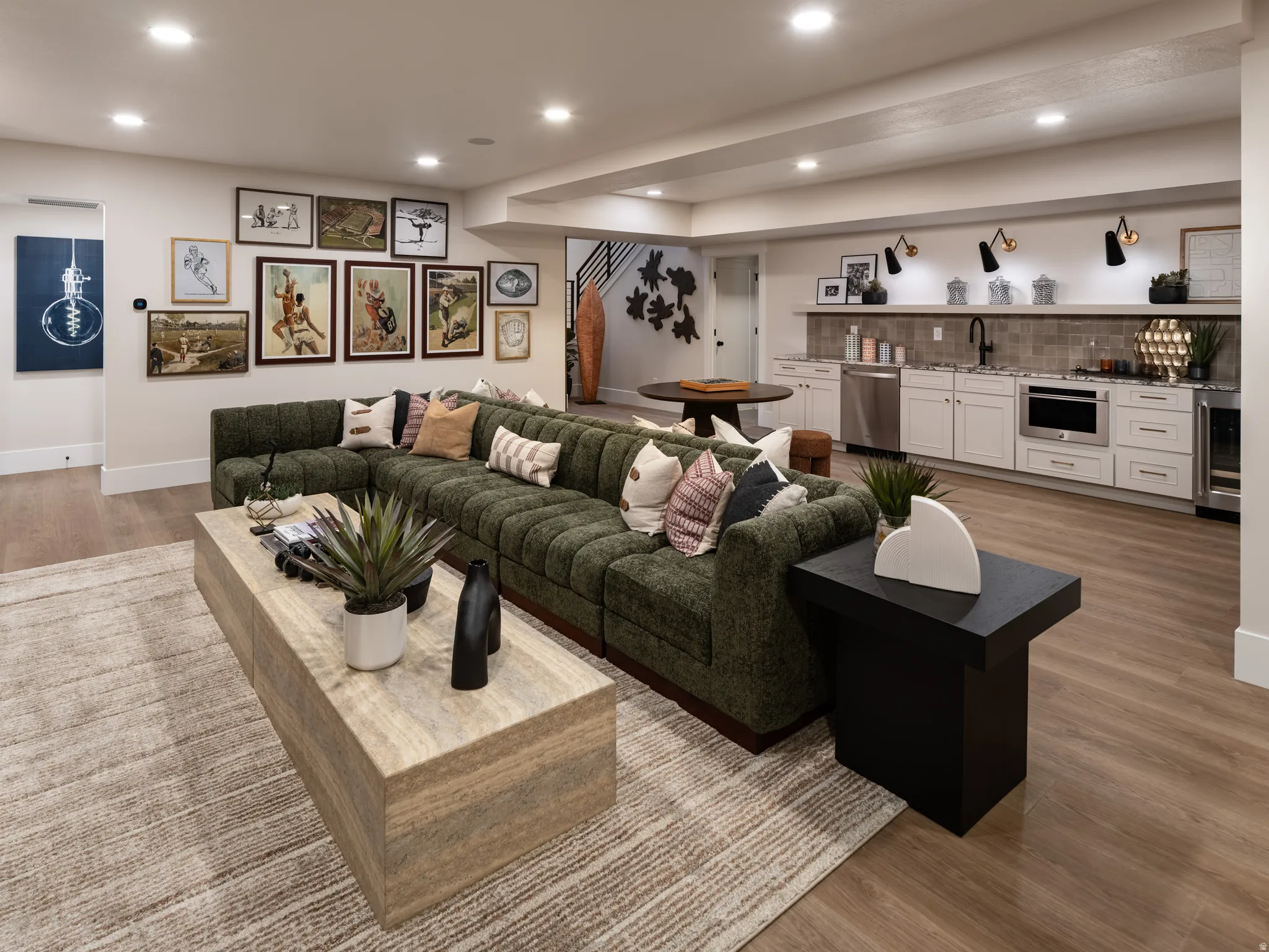 Spacious recreation room featuring recessed lighting and wood-finish flooring