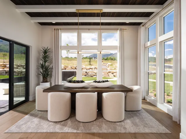 Dining area with wood-finish flooring and a coffered ceiling