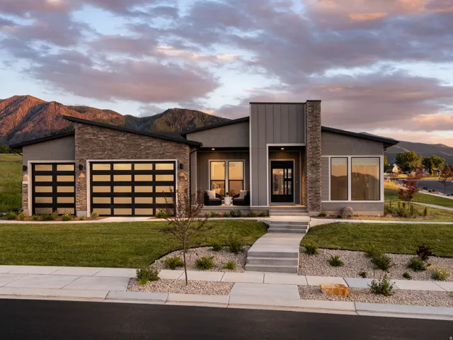 Contemporary exterior featuring stone accents and a low-sloping roofline
