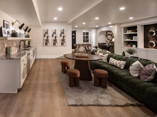 Entertainment space featuring wood-finish flooring and recessed lighting