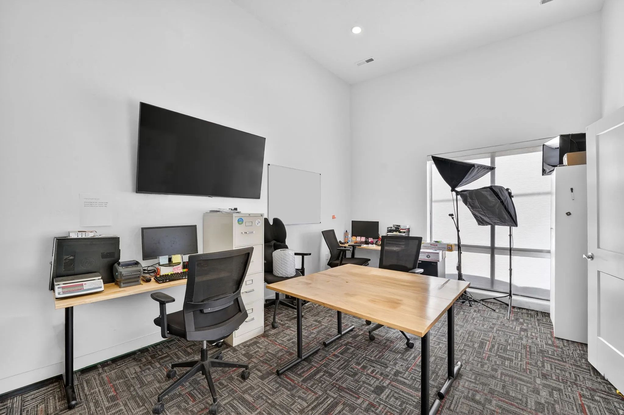 Spacious interior with high ceilings and recessed lighting