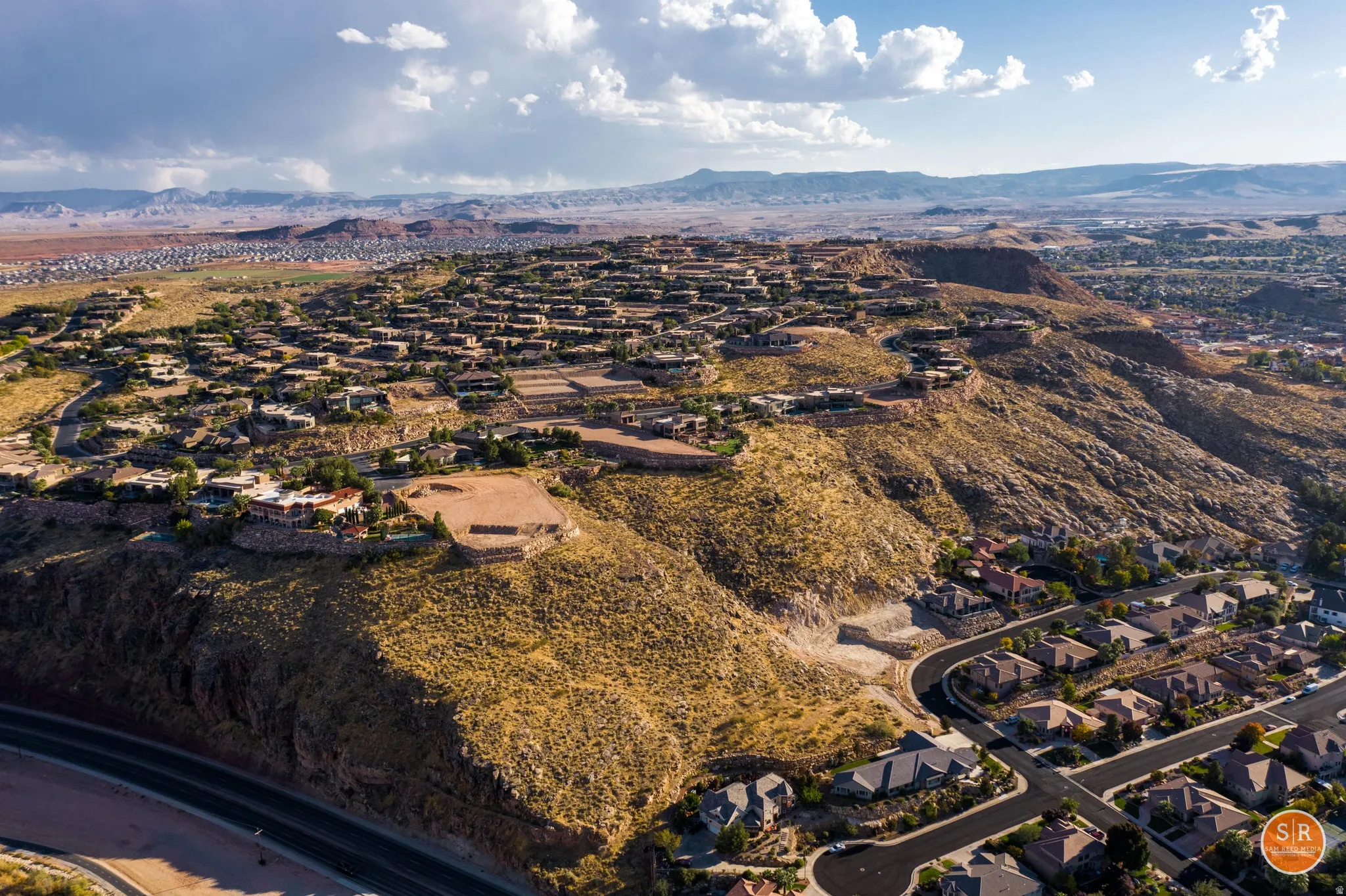 Expansive residential development nestled into arid hillside terrain