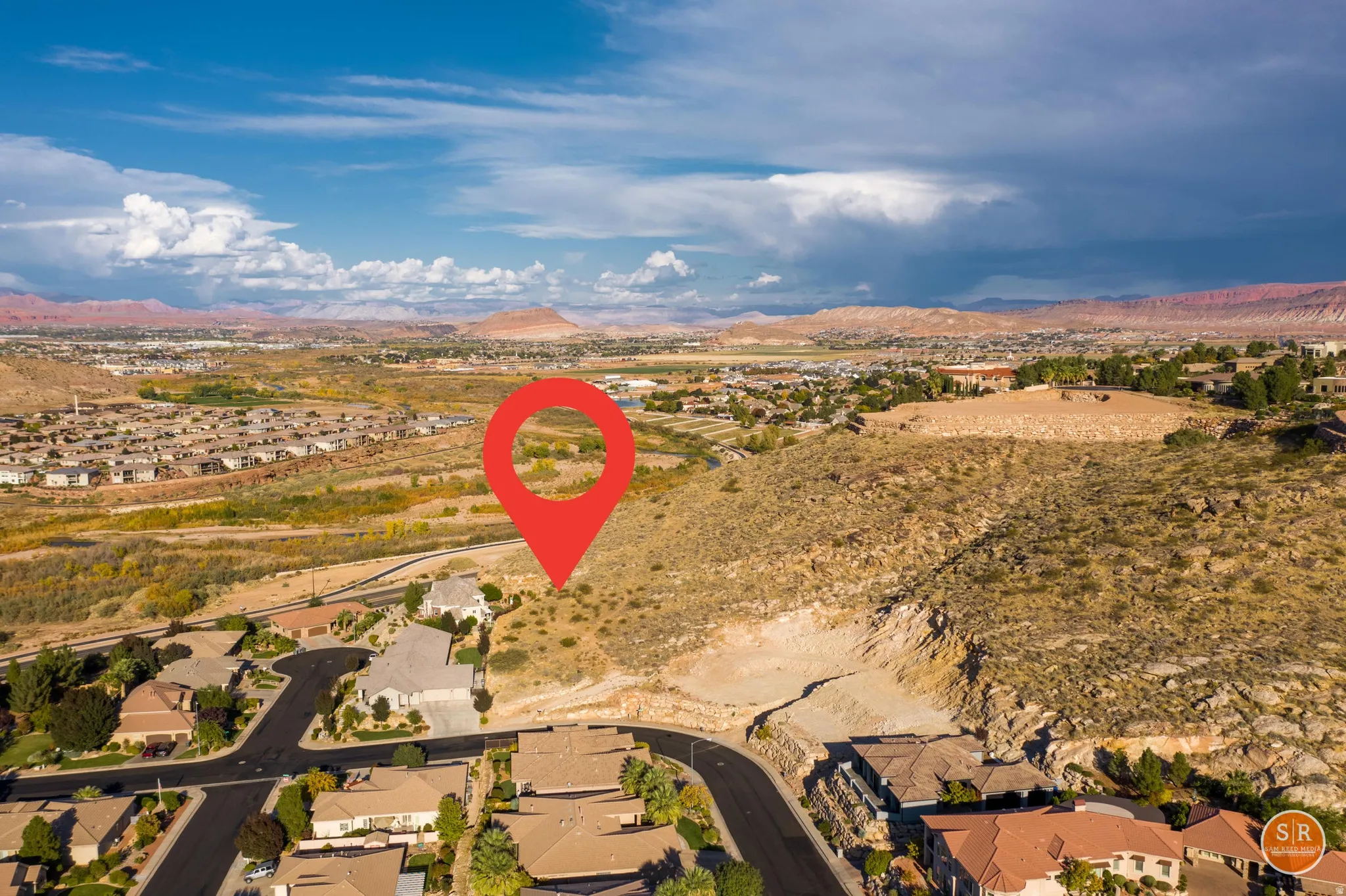 Aerial perspective showcasing a large residential area with extensive natural landscaping