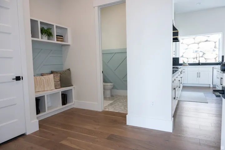 Built-in mudroom bench with cubby storage and decorative accent paneling