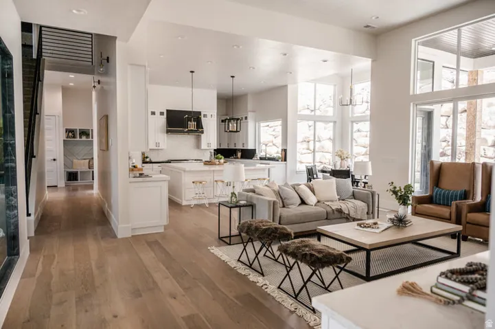 Open-concept living area with light wood-finish flooring