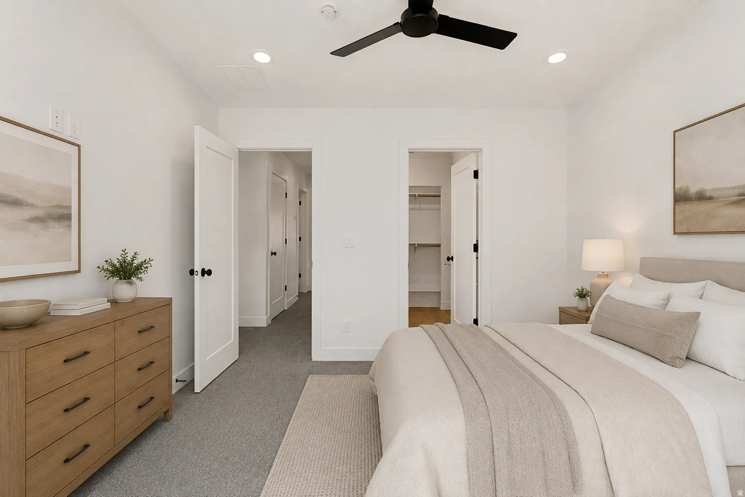 Bedroom featuring light gray carpeting, a contemporary black ceiling fan, recessed lighting, and white paneled doors