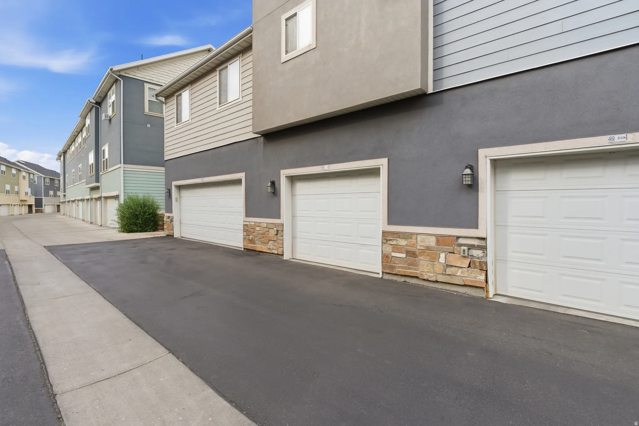 Modern multi-story building featuring stucco and horizontal siding