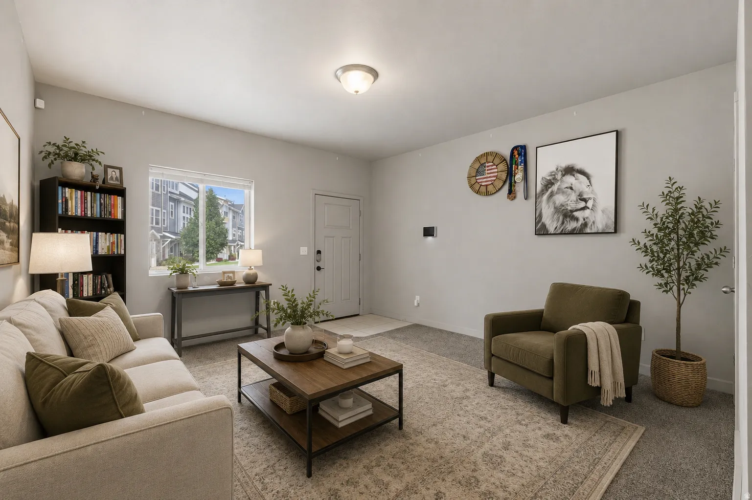 Comfortable living area featuring light gray walls, carpet flooring, a front entry door with side window, a window overlooking the neighborhood, and a ceiling-mounted light fixture