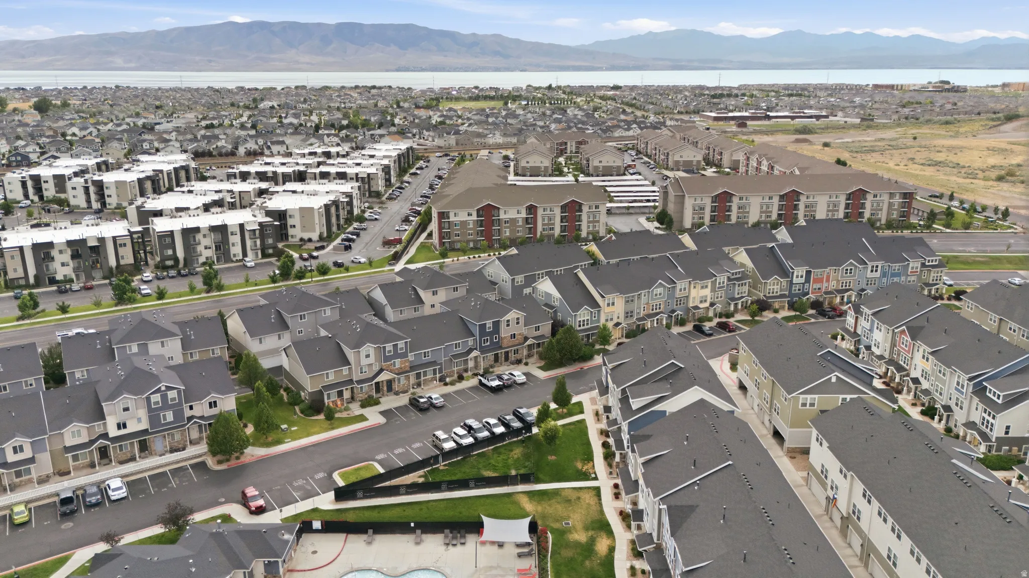 Expansive residential development featuring various multi-story buildings and townhomes