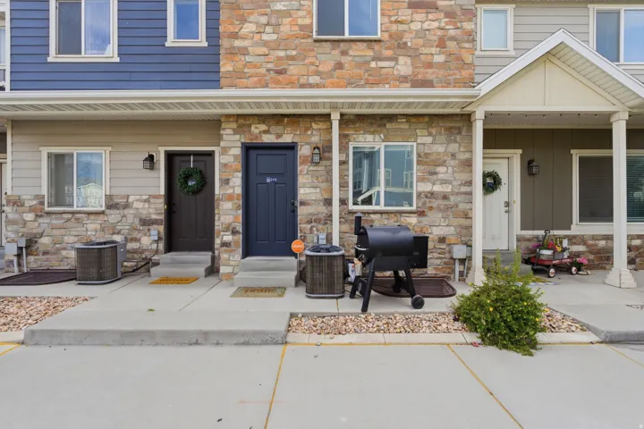 Stone and siding exterior with a covered entry