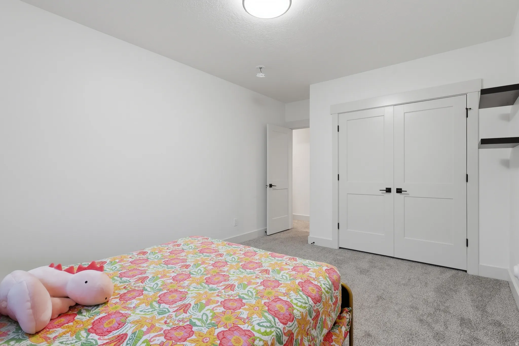 #4 Bedroom featuring neutral gray carpet flooring, white walls, and a flush mount ceiling light