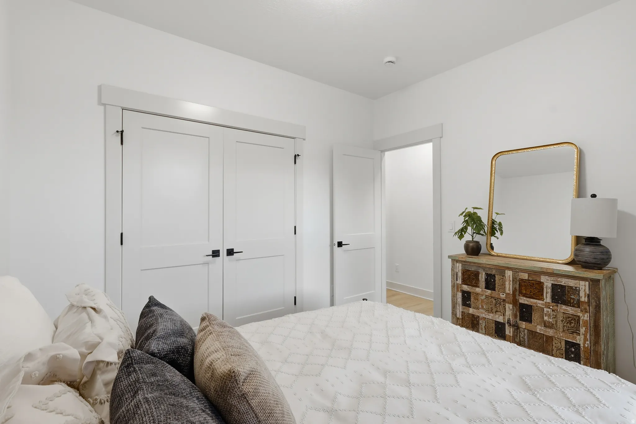 Clean white walls with white trim and baseboards