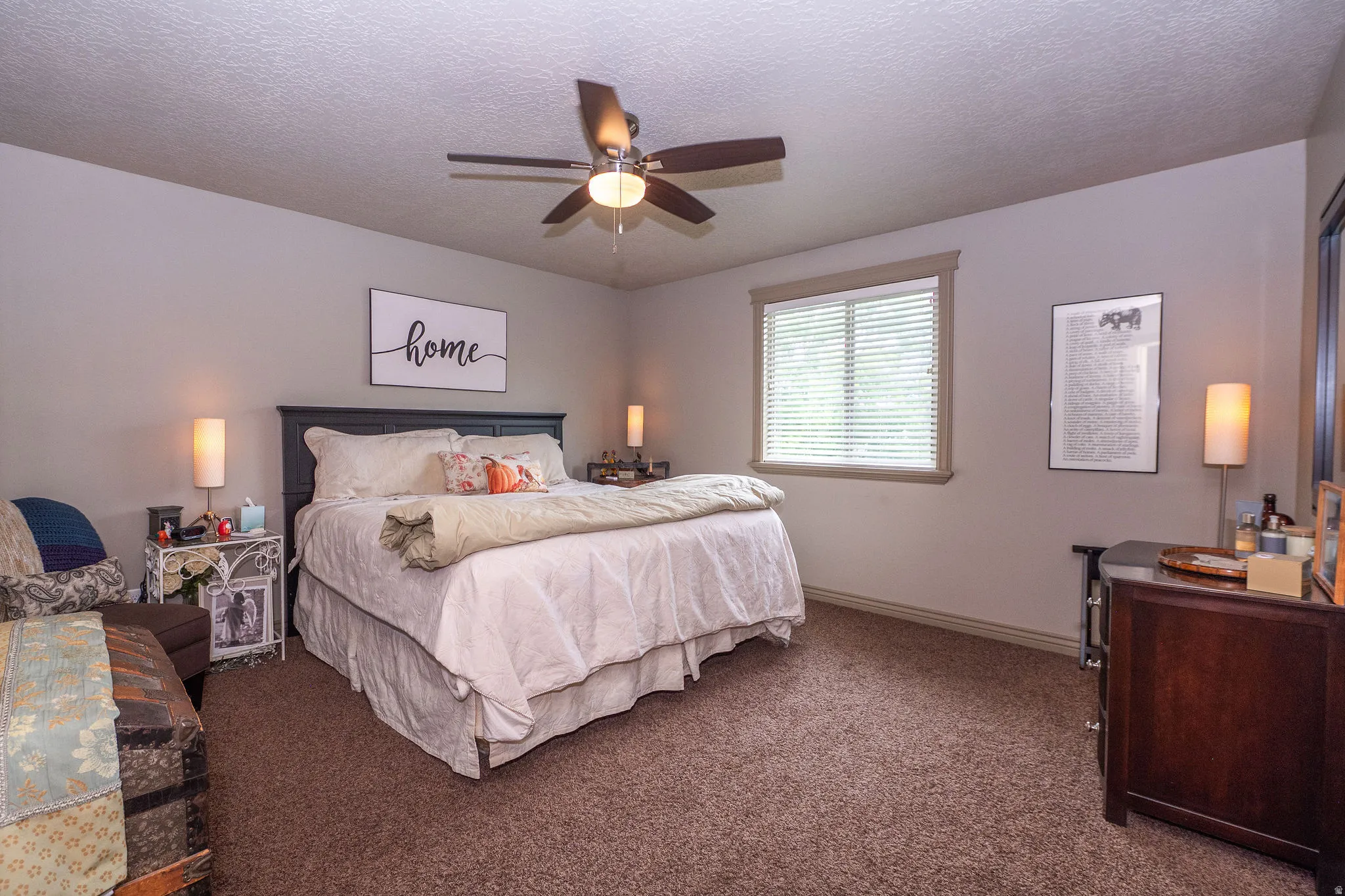 Neutral paint tones and brown carpeting characterize this room