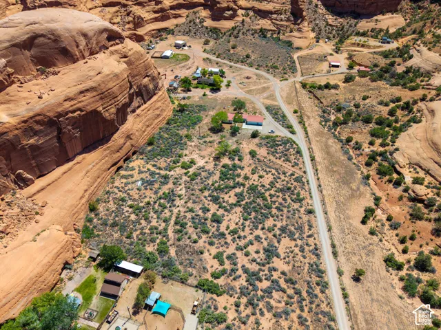 Expansive desert landscape with multiple residential structures