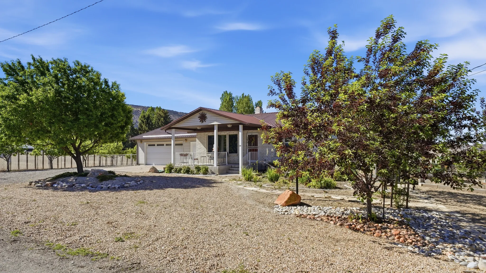 Single-story property with a covered front porch featuring white pillars