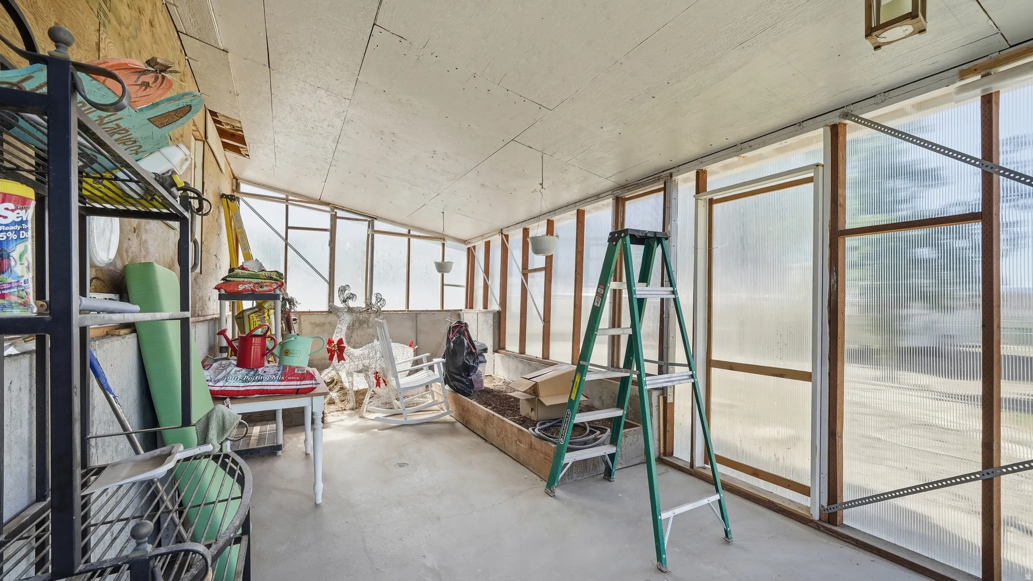 GREEN HOUSE with concrete floor.