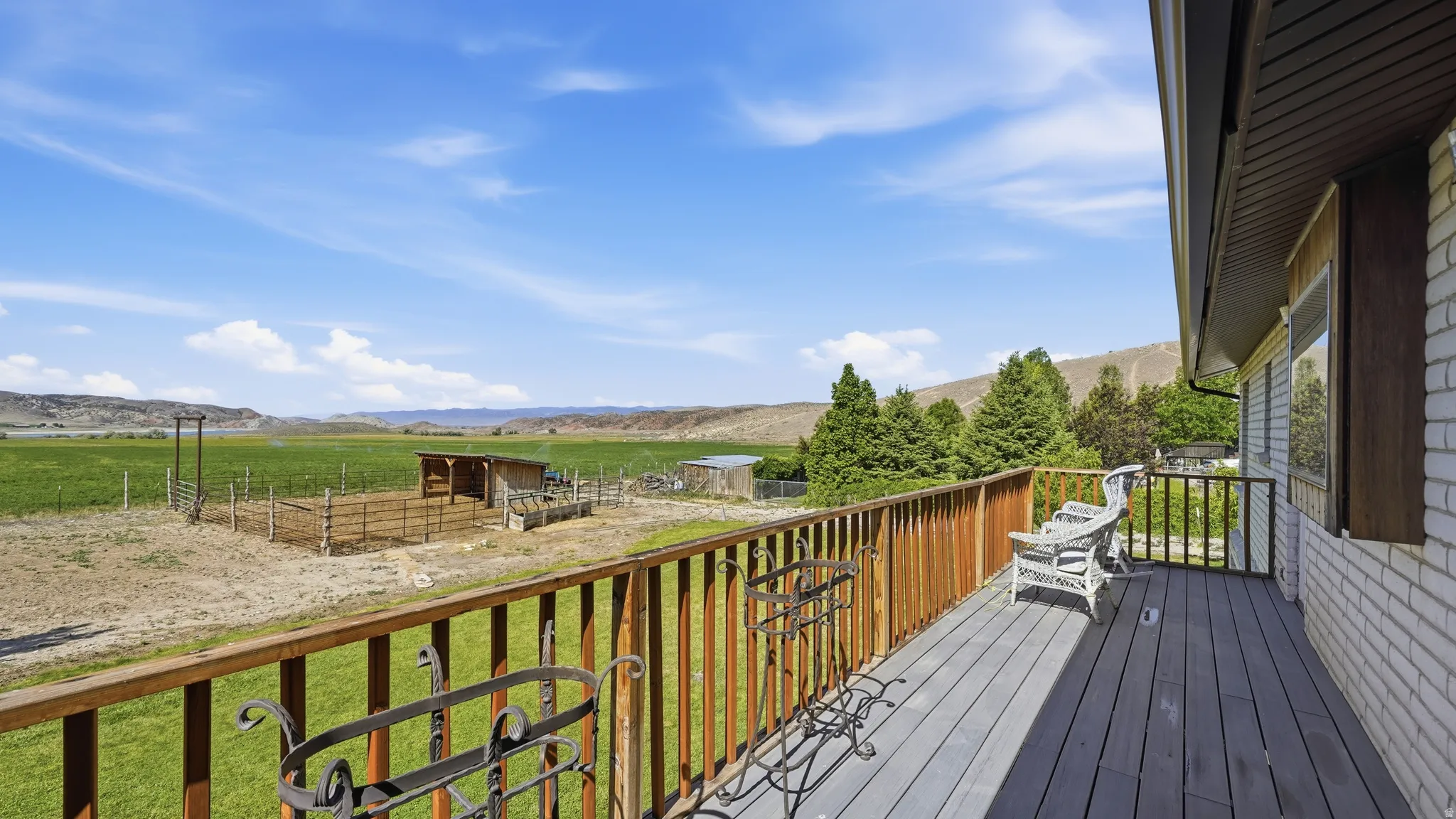 Expansive deck with composite decking and wood railing, providing open-air space