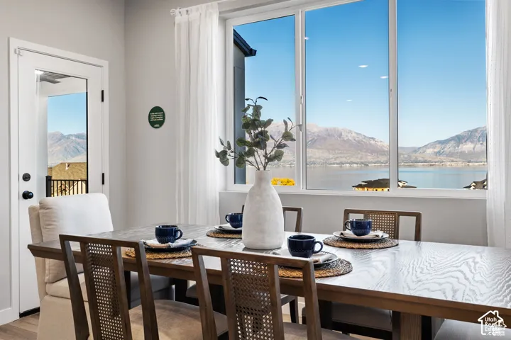 Expansive picture window showcasing a lake and mountain backdrop