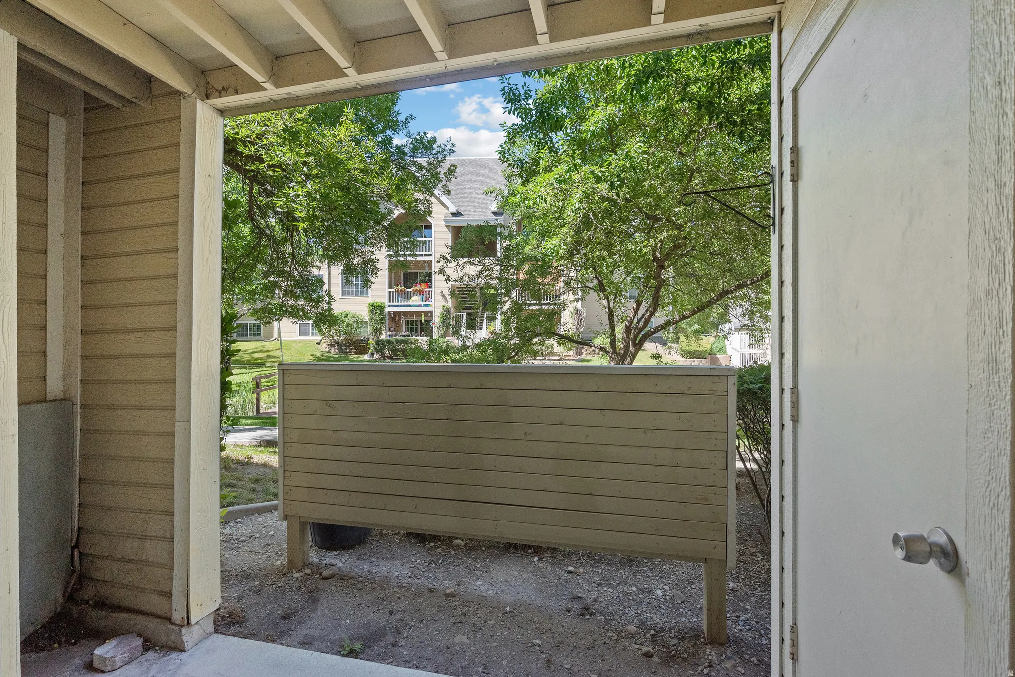 Patio area featuring a privacy fence and concrete flooring