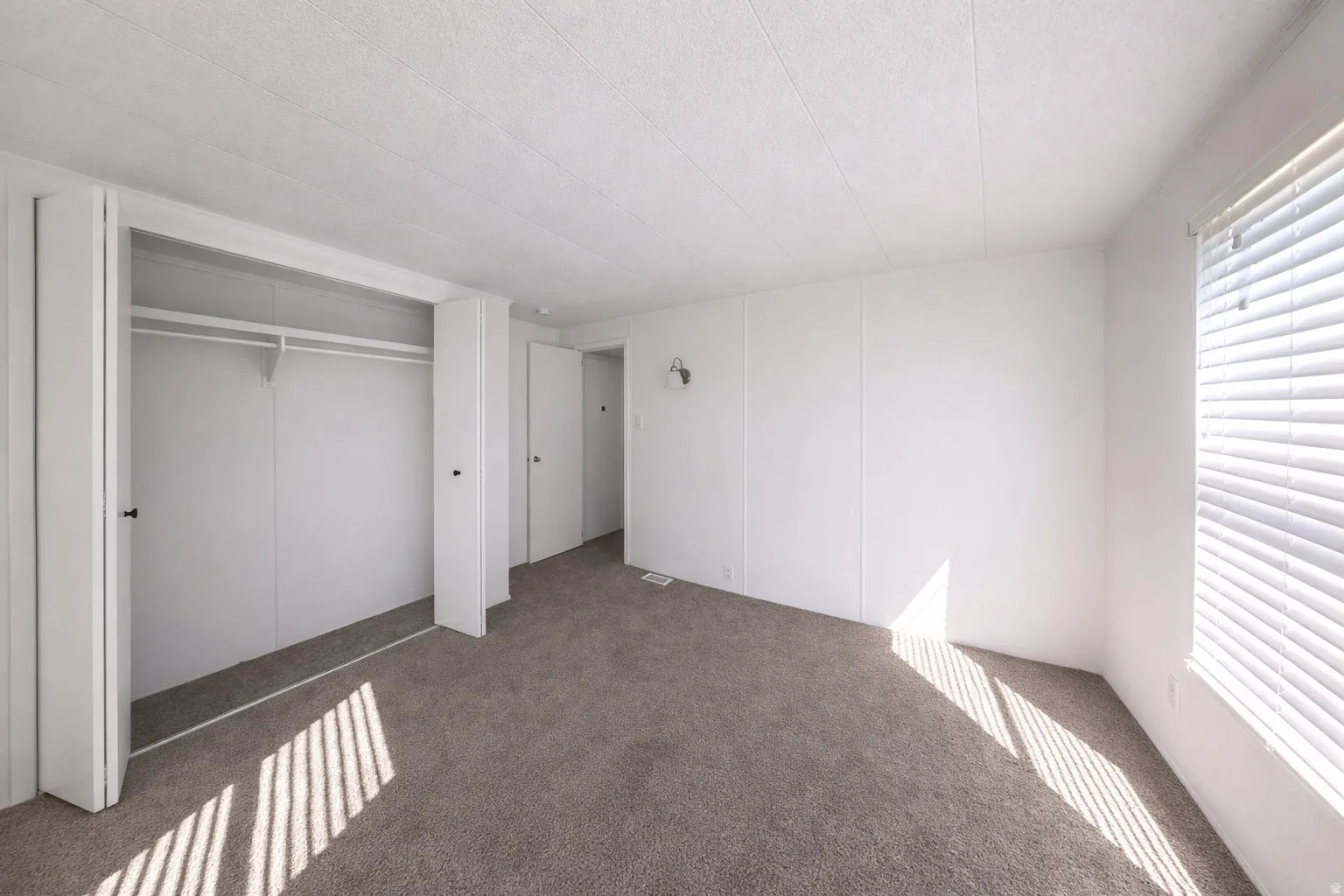Image from 2 yrs ago before move-in. This is the larger of the 3 bedrooms.