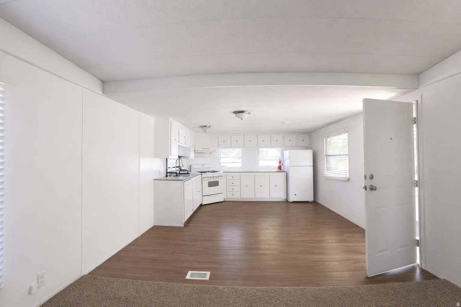 Image from 2 yrs ago before move-in. Reverse look from the Family room to the kitchen.