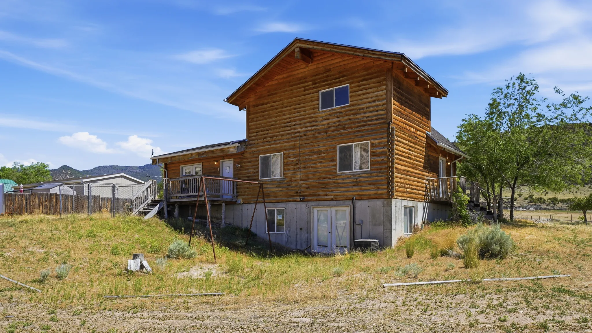 Log cabin style exterior with a concrete foundation