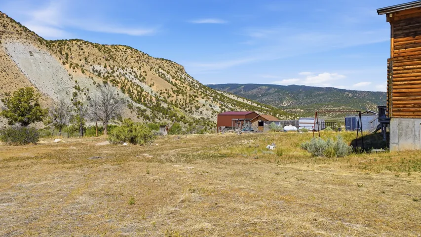 Expansive outdoor space featuring a natural landscape and distant mountainous terrain