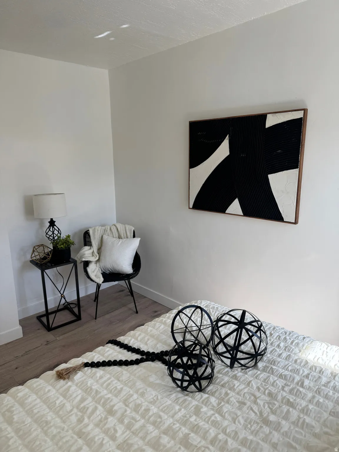 White walls with wood-finish flooring