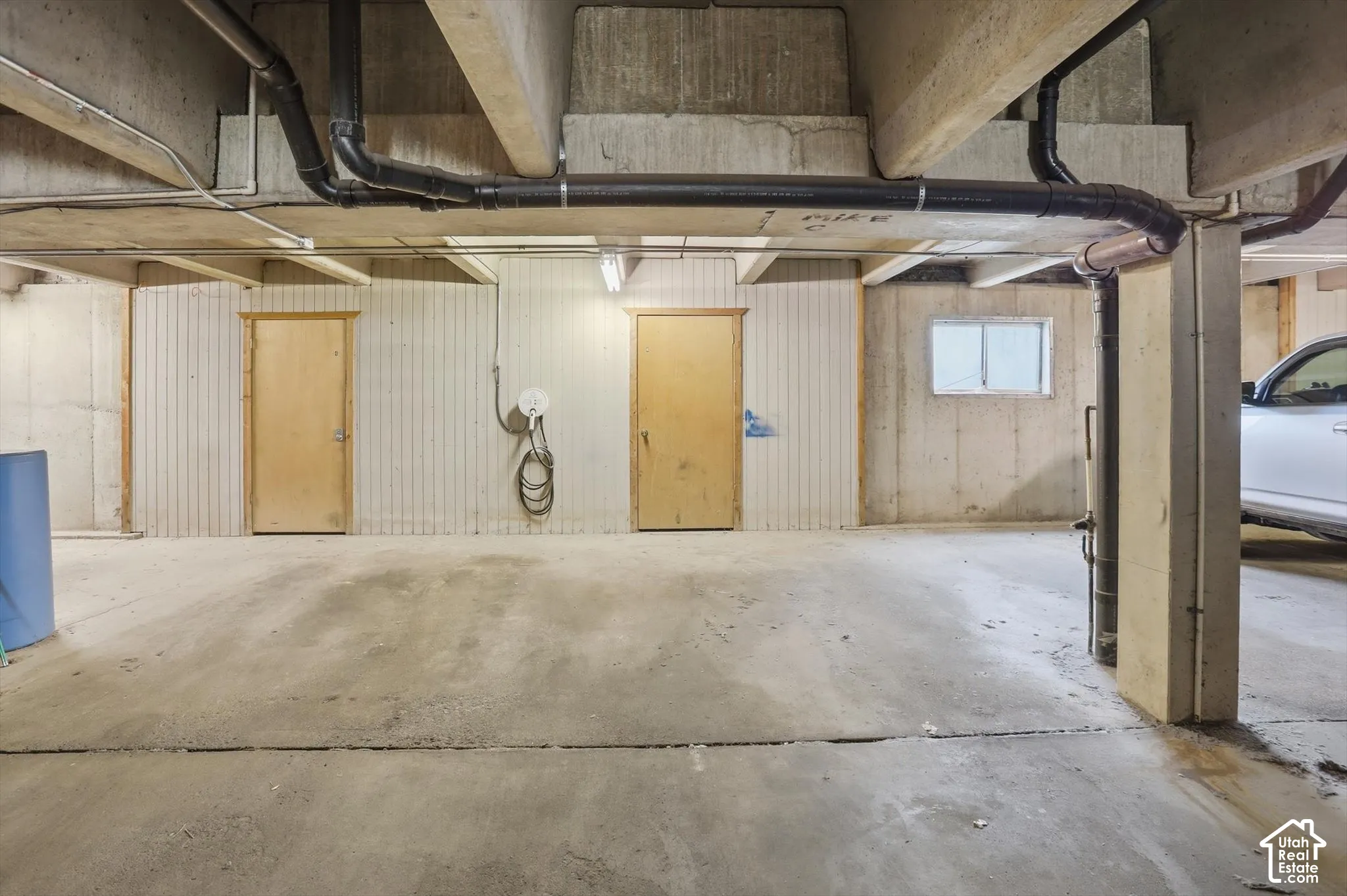 2 dedicated garage stalls and storage with water softner and EV charger