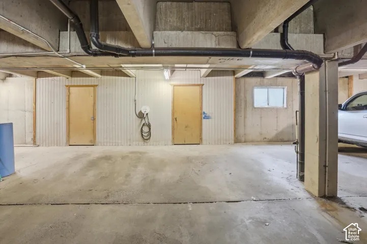 2 dedicated garage stalls and storage with water softner and EV charger