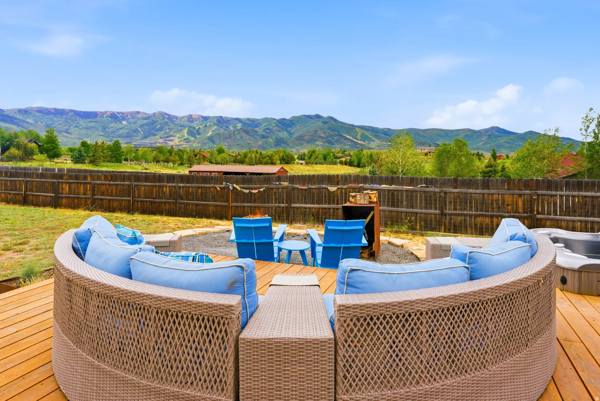Outdoor wood-finish deck with a built-in hot tub