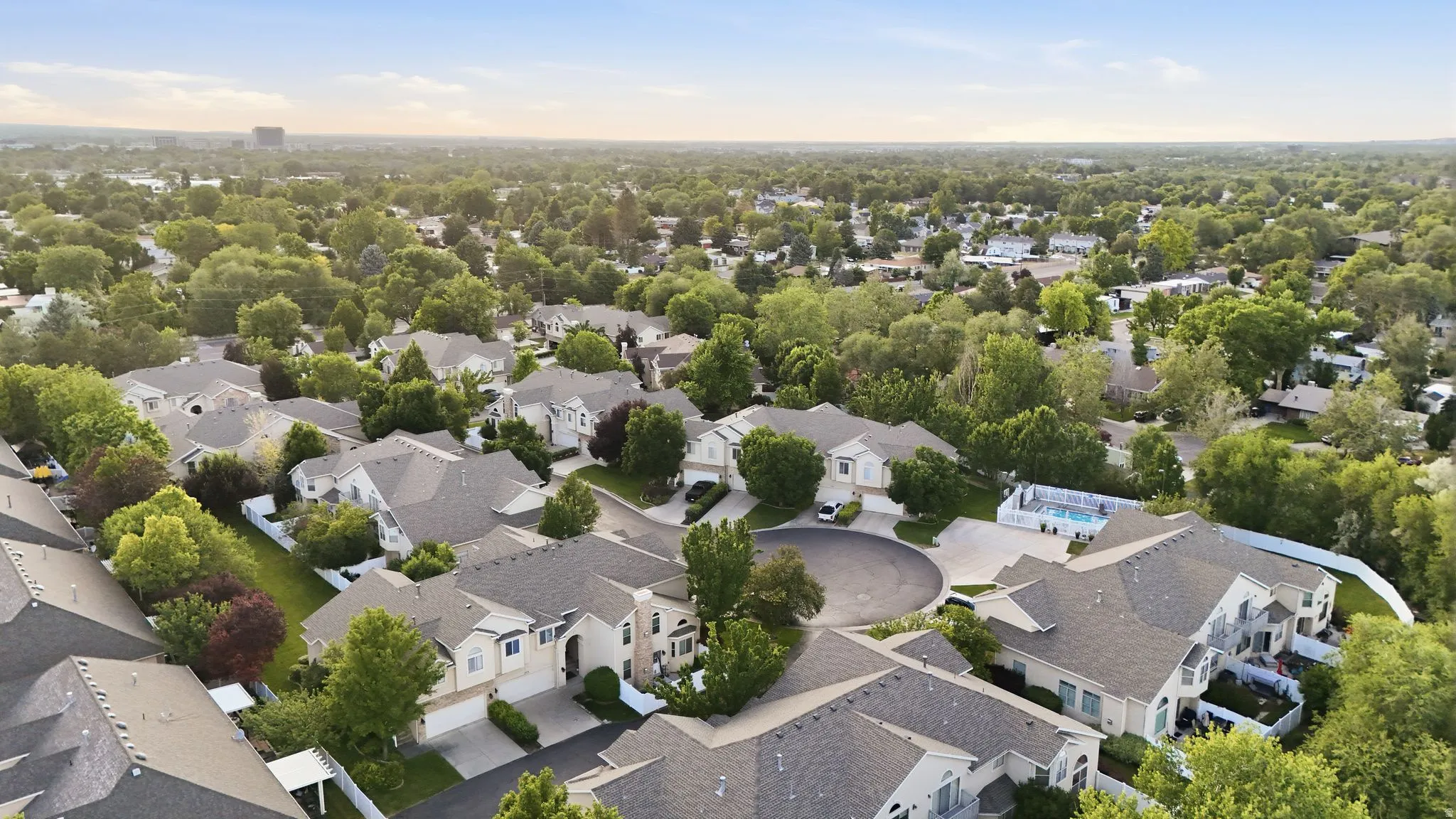 Established residential area featuring a cul-de-sac with mature landscaping and multiple properties