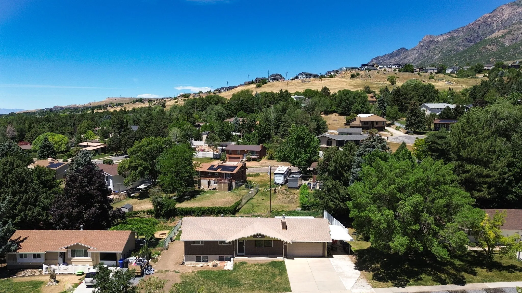 Ranch-style residence featuring a single-story design, an attached two-car garage, and a concrete driveway