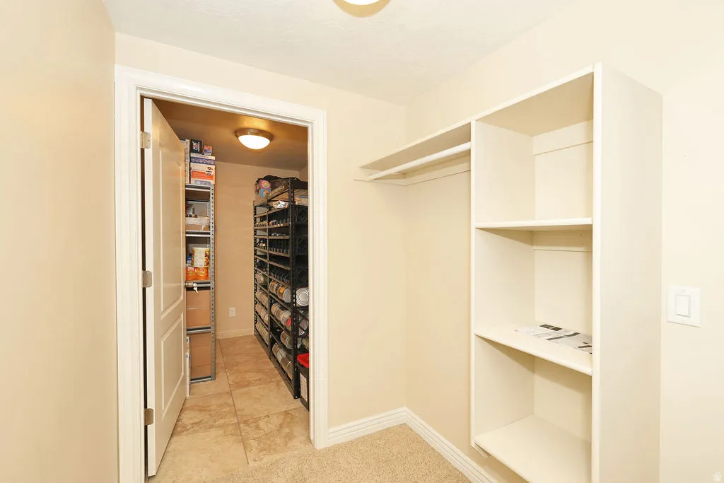 Built-in closet shelving and hanging rod provide storage