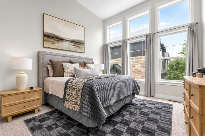 Bedroom featuring light-colored walls and carpeted flooring