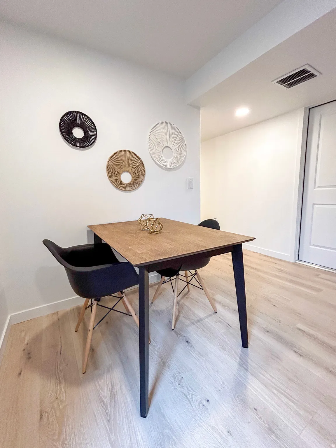 Light wood-finish flooring provides a bright foundation for this space