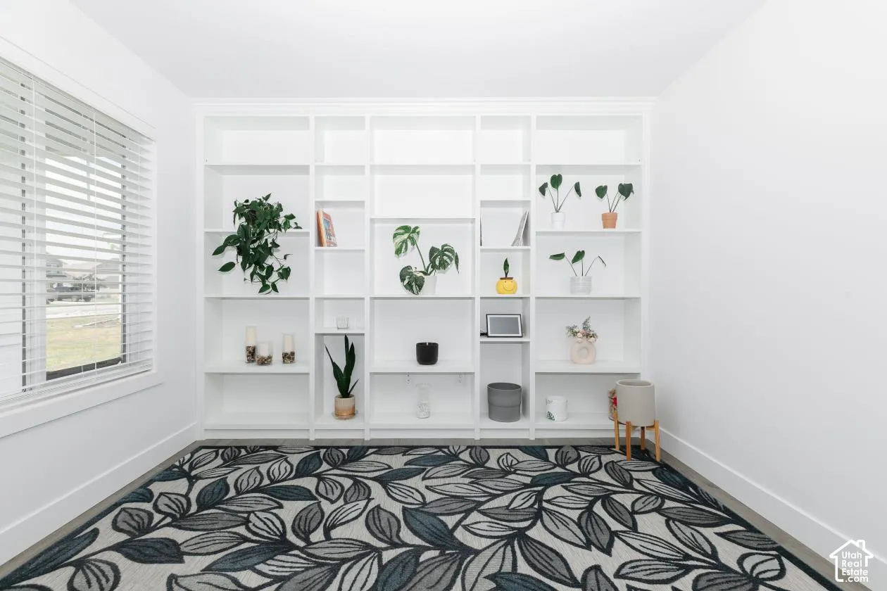 Built-in white shelving unit featuring multiple compartments
