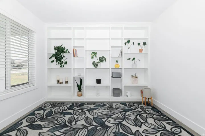 Built-in white shelving unit featuring multiple compartments