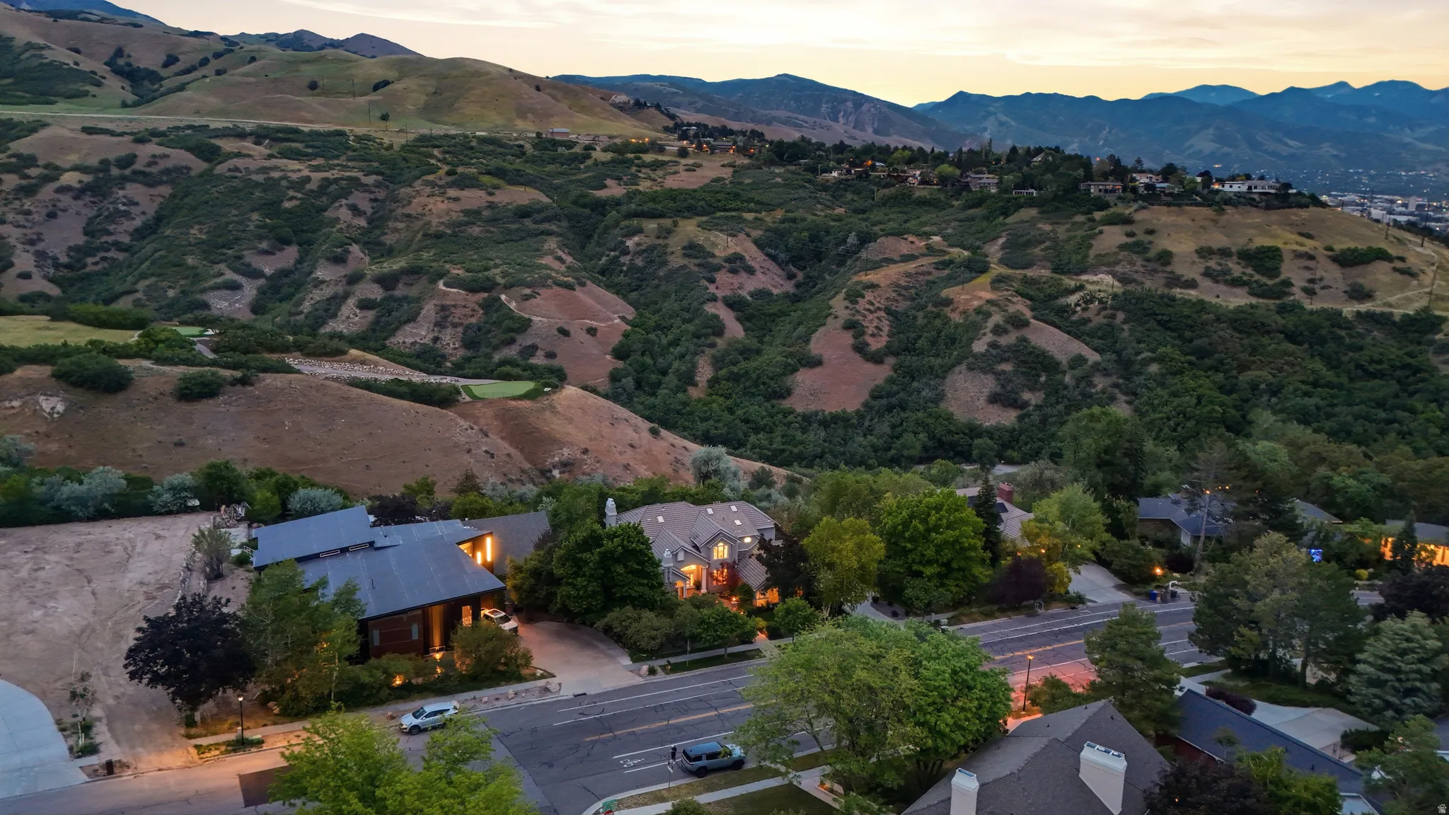 Expansive mountain backdrop featuring varied terrain and lush vegetation