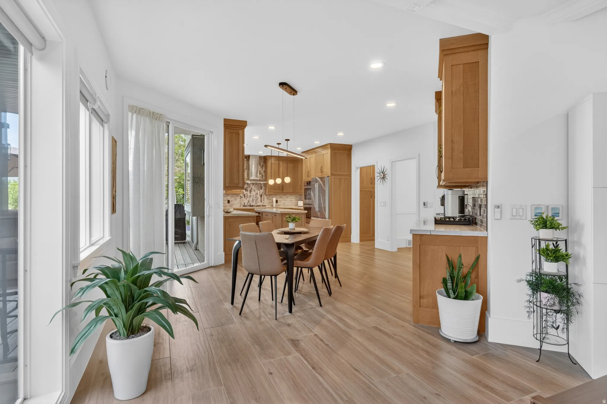 Bright interior space featuring wood-finish flooring and a sliding glass door