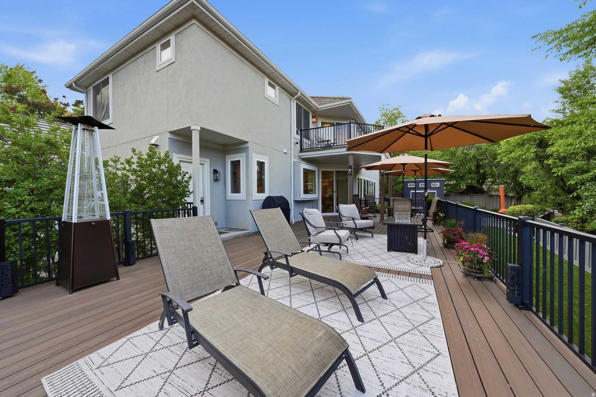 Expansive multi-level composite decking with dark railings