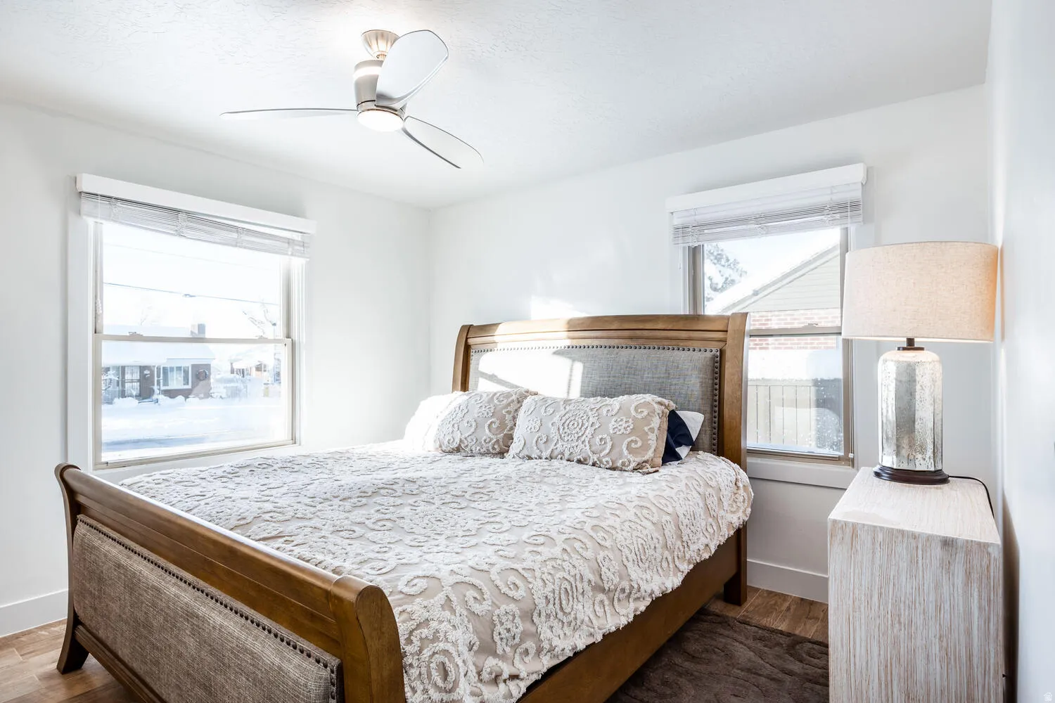 Bright room featuring wood-finish flooring and white baseboards