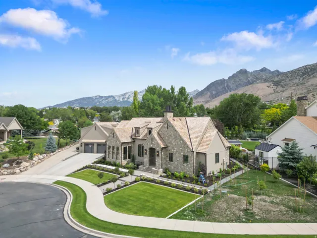 Stone and stucco exterior with a cedar shake roof