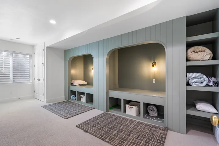 Built-in alcoves with integrated seating and wall sconces