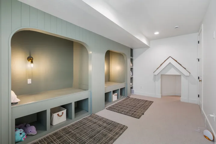 Built-in arched nooks with integrated bench seating and open storage