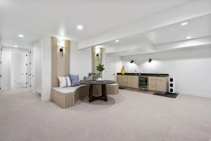 Spacious lower level featuring light-toned carpeting and recessed lighting