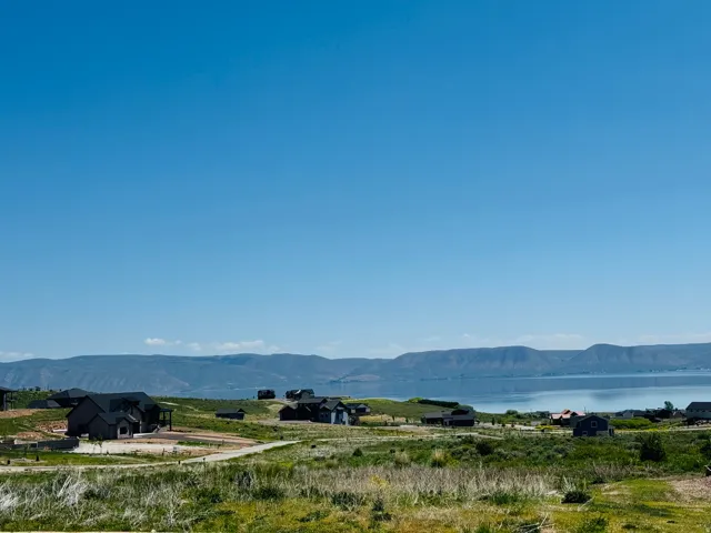 Rolling terrain featuring natural landscaping and mountain scenery