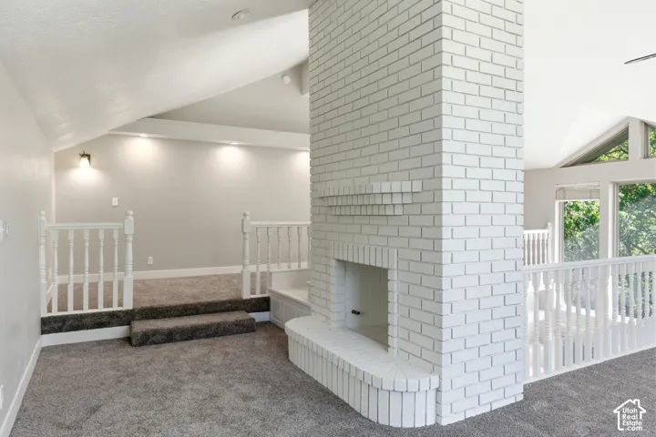 White brick fireplace with an integrated hearth bench