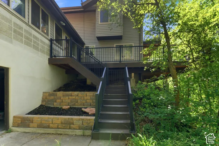 Multi-level deck with dark railing, offering outdoor access