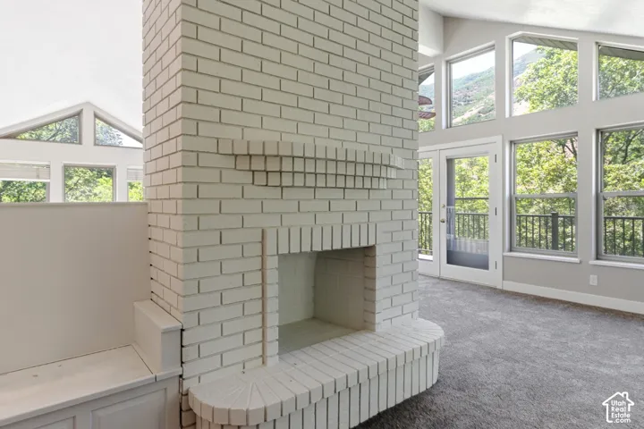 Central white brick fireplace with hearth